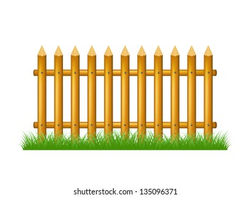 Wooden fence standing in grass