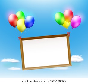 wooden frame hanging on balloons