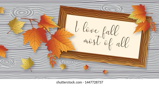 Wooden frame with text on the wooden background grey color. Decorate with orange tone color of maple leaves.
