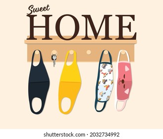 Wooden Hanger For Keys And Family Cloth Face Masks On Light Wall With Sweet Home Text Decoration