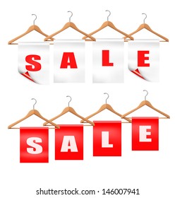 Wooden hangers with sale tags. Discount concept. Vector.