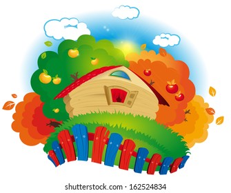 wooden house surrounded by a colored fence on the background of autumn