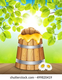 Wooden keg of honey on a background of green garden