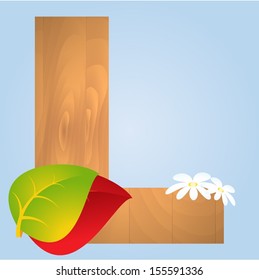 Wooden letter with autumn leaves on blue background