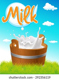 wooden pail with milk tag, green grass and blue sky