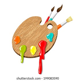 A wooden palette with colored drops of oil-paint and three brushes