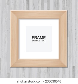 Wooden photo frame on vintage wooden wall background with area for copy space.