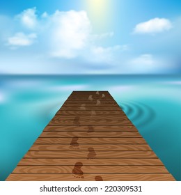 Wooden pier at sea with cloudscape