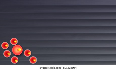 Wooden planks background with  wax,  burning, aroma candle, a view from the top. Template for greeting cards, invention or greetings. Romantic background