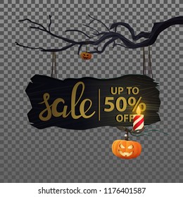 Wooden plate with the inscription: "Halloween sale " hanging on a branch