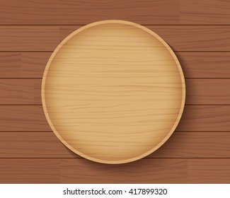 wooden plate on wood table background 