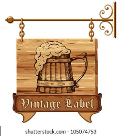 Wooden pub sign with mug of beer