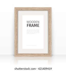 Wooden rectangle light frame on a glossy surface. Clipping paths included.