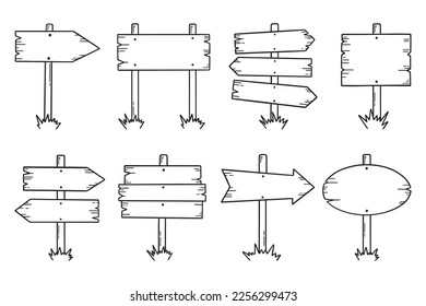 Wooden road signs doodle set. Wooden direction signs and arrows in sketch style.  Hand drawn vector illustration isolated on white background.