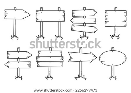 Wooden road signs doodle set. Wooden direction signs and arrows in sketch style.  Hand drawn vector illustration isolated on white background.