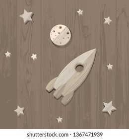 wooden rocket, moon and stars on wooden background