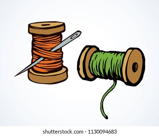 Wooden sheave of vibrant orange and mint color cotton fiber filament and big pin on white backdrop. Bright hand drawn needlecraft logo sketchy in art retro style. Closeup view with space for text
