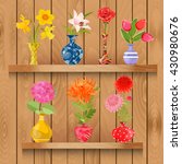 Wooden shelves  with collection of glass vases with lovely flowers for your design
