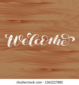 Wooden sign. Welcome brush lettering. Vector illustration