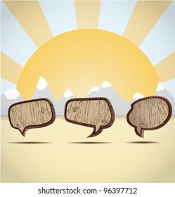 wooden speech bubbles on the background of the mountains in the