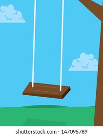 Wooden swing hanging from a tree 