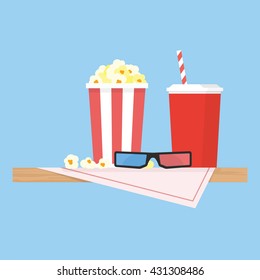 Wooden table with table cloth and popcorn