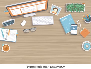 Wooden table with monitor, book, notebook, headphones, pencils, glasses, phone, keyboard, tea, donut. Workplace Desktop Workspace background top view. Vector illustration