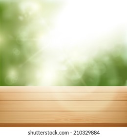 wooden table on background of trees