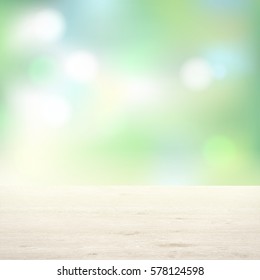 Wooden table on background of trees. Light green background blur.