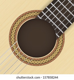 Wooden textured background with classical guitar rosette in the foreground