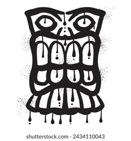 Wooden tiki mask graffiti with black spray paint art