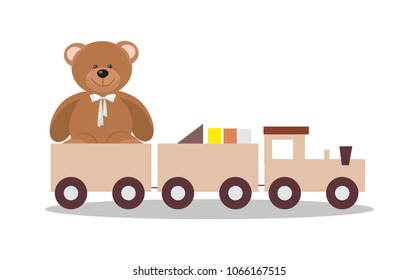 Wooden toy train with colorful blocs and teddy bear isolated over white