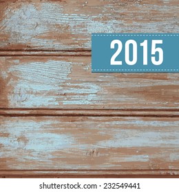 Wooden vector background with old blue peeling paint and label with 2015 year