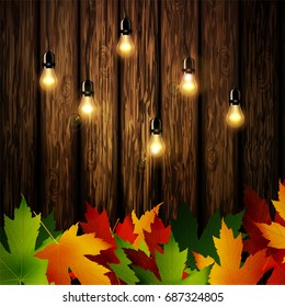 Wooden wall with autumn leaves