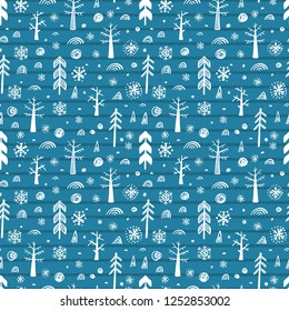 Woodland background. Winter forest seamless pattern. Christmas and New Year Pattern. Hand drawn Doodle Trees, Christmas Tree, Snow, Snowflakes, Snowballs. Holiday Xmas wallpaper.