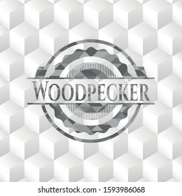 Woodpecker grey badge with geometric cube white background