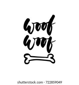 Woof-woof - Symbol of the year 2018 Dog hand drawn lettering quote isolated on the white background. Fun brush ink inscription for greeting card or t-shirt print