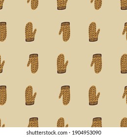 Wool knitted seamless pattern with beige colored mittens ornament. Light pastel background. Graphic design for wrapping paper and fabric textures. Vector Illustration.