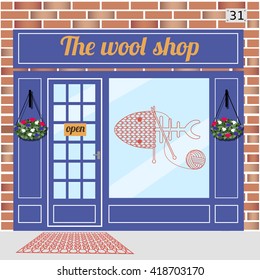 Wool shop building. Facade of red brick. Knitting sign sticker on window. Vector illustration EPS10