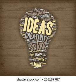 Word Cloud - Creativity, Inspiration and Ideas. word cloud about the creative process, Light Bulb shape on Wooden Background 
