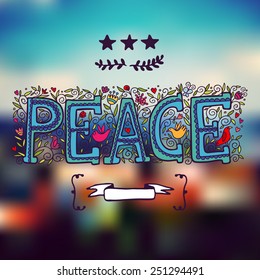 Word peace on blurred background.