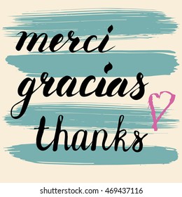 Words "Merci, gracias, thanks". Word "Thanks" hand written in English, Spanish and French.