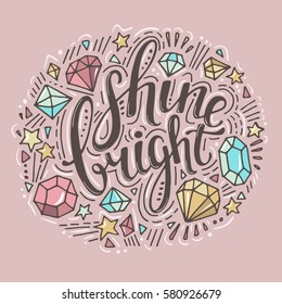 Words Shine Bright. Vector inspirational quote with doodle ornament. Crystals and diamonds. Hand lettering. Can be printed on T-shirts, bags, posters, invitations, cards, phone cases, pillows.