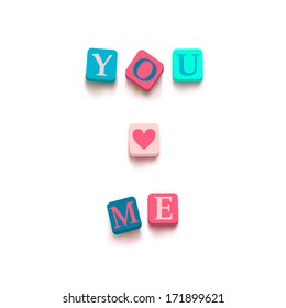 Words "you love me" with colorful blocks isolated on a white background. Description with bright cubes. Valentine's day card. Vector illustration EPS 10.