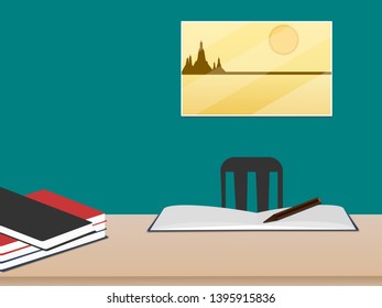 Work desk with books in the room on green wall with picture on the window