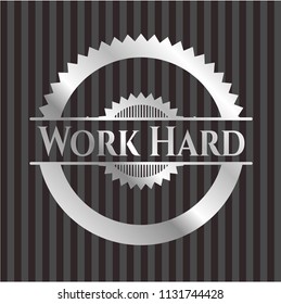 Work Hard silver emblem or badge