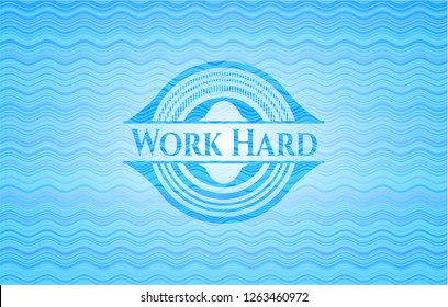 Work Hard sky blue water wave emblem.