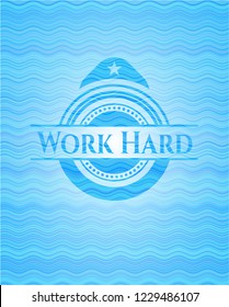 Work Hard water wave representation emblem.