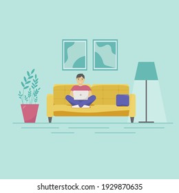 Work from home, isolation. Man sitting on a sofa with a laptop in the living room
