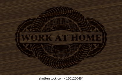 Work at Home text inside dark wood realistic badge. Brown graceful background. Artistic illustration. 